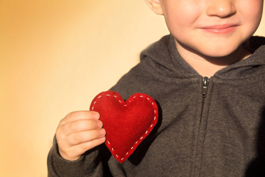 Red heart in hand